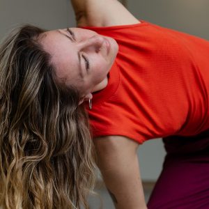 Hannah from B-side Yoga practicing Extended Side Angle Pose